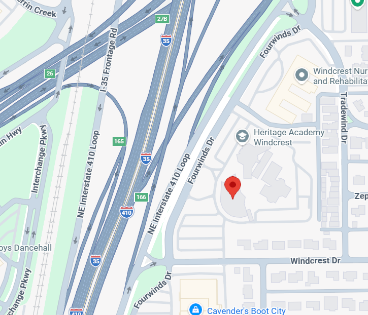 Map view with a red location pin near Heritage Academy Windcrest beside major highways.