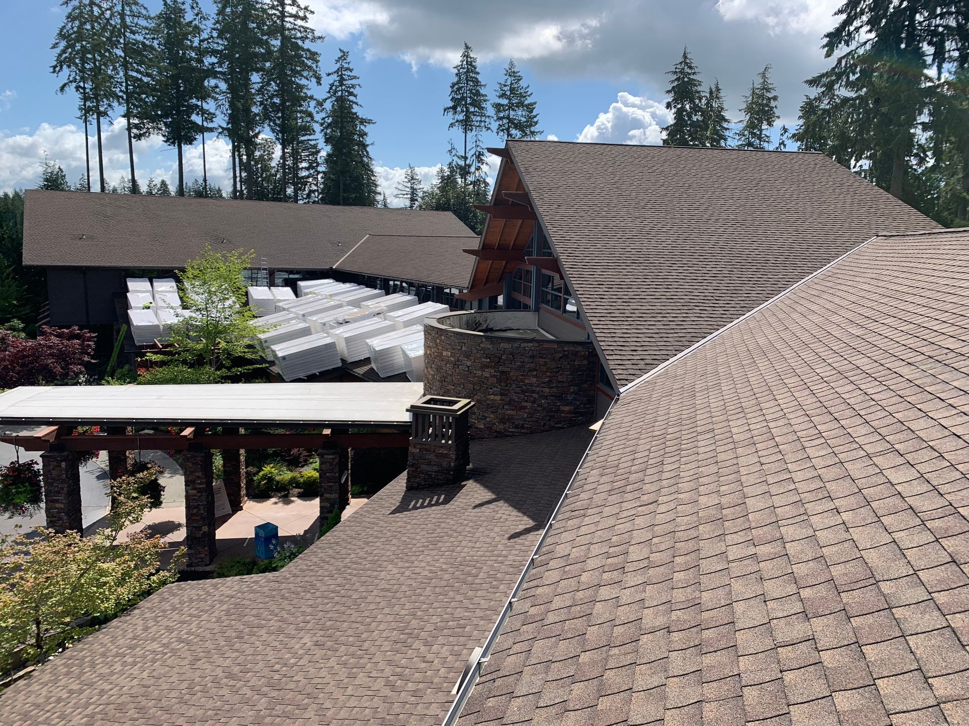 A large house with a roof that has a lot of shingles on it
