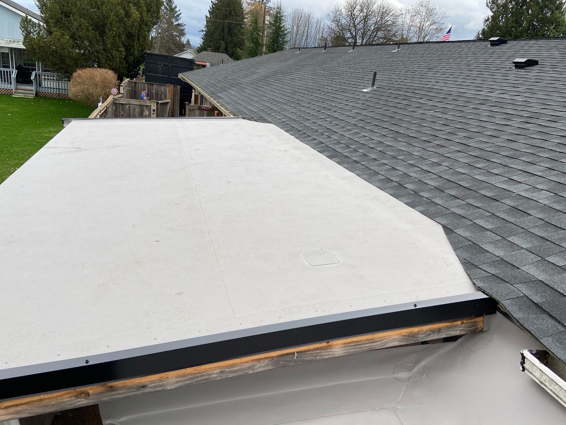A roof with a white roof and a gray roof.