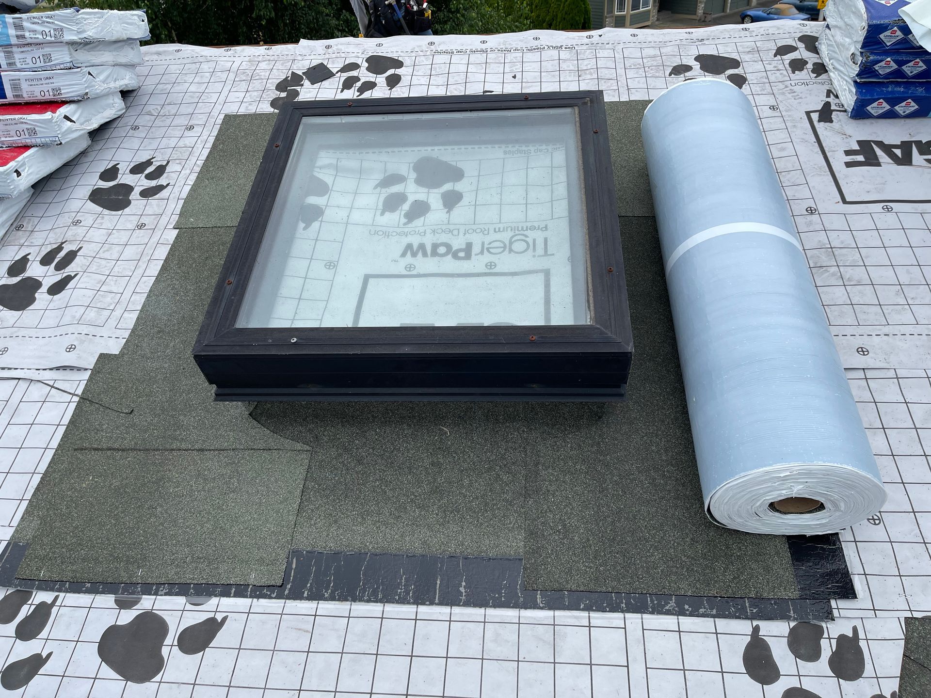 A skylight is being installed on top of a roof