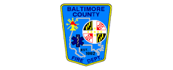 Baltimore County Fire Department badge. Blue, yellow, and white seal with symbols and text.