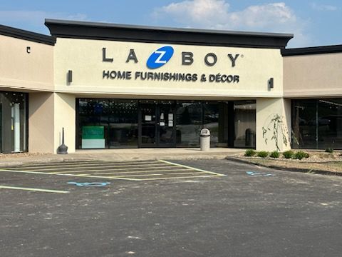 A home furnishing and decor store with a parking lot in front of it