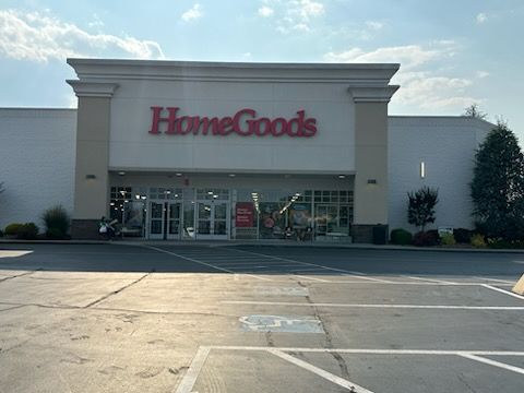 A store with a parking lot in front of it