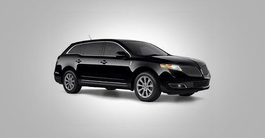 Black Lincoln SUV with tinted windows against white background