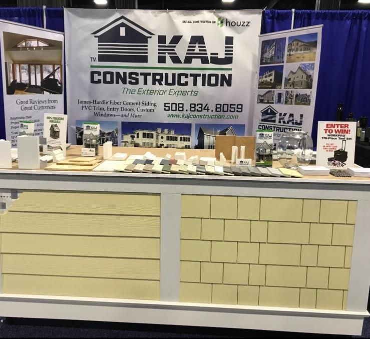 A brick counter with a sign that says KAJ Construction.