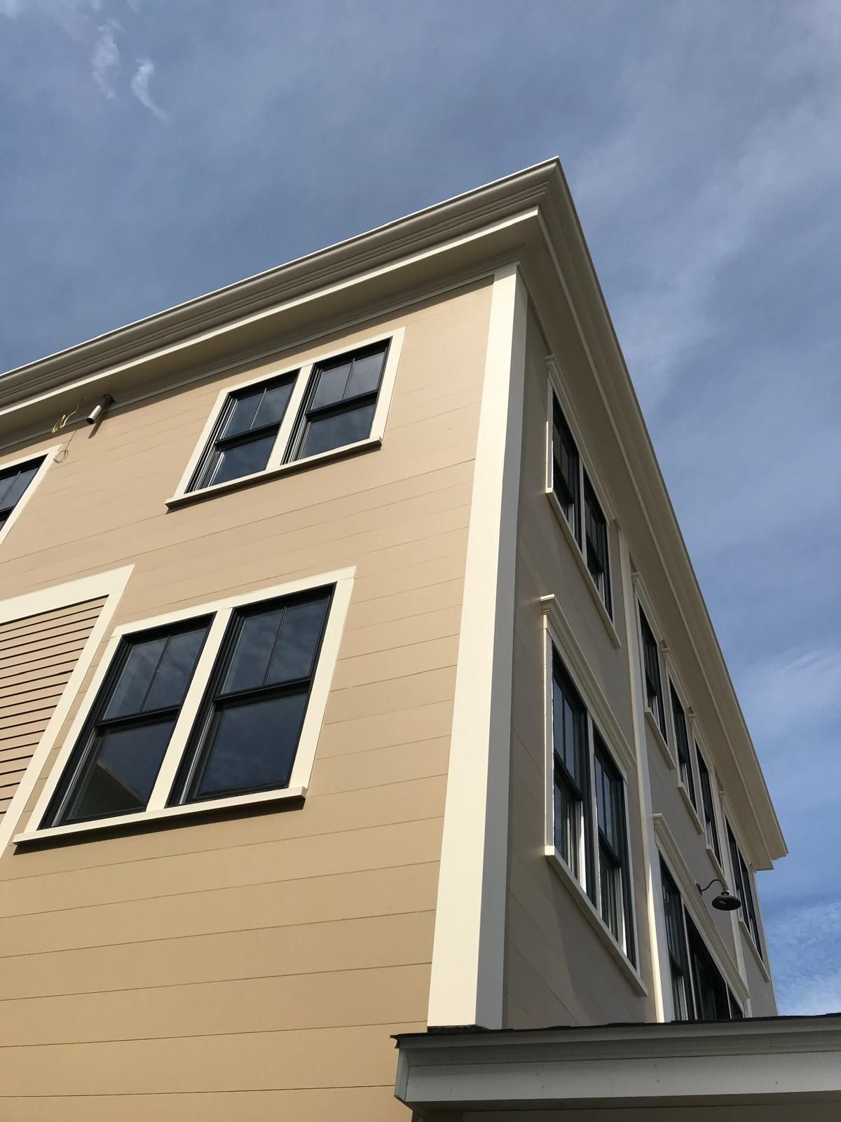 Looking up at a building with a lot of windows
