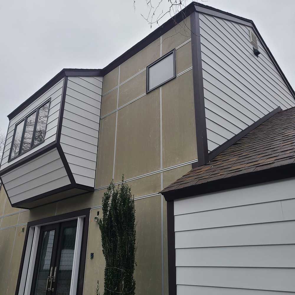 A house with a balcony on the side of it