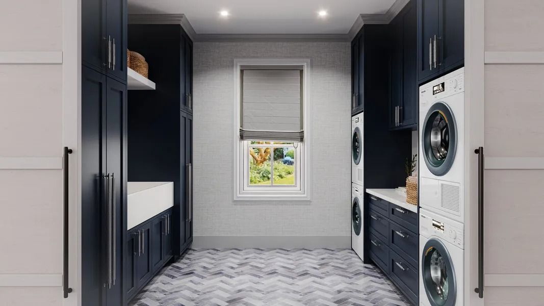 Laundry room with dark blue cabinets, white appliances, and a window.