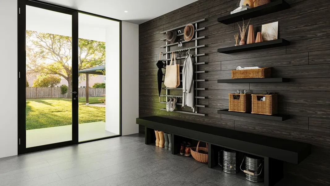 Mudroom with storage bench, coat rack, shelves, and door to backyard.