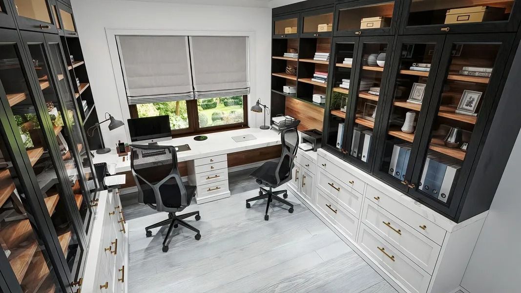 Home office with built-in bookshelves, two desks, and a window. Black, white, and wood tones dominate the room.