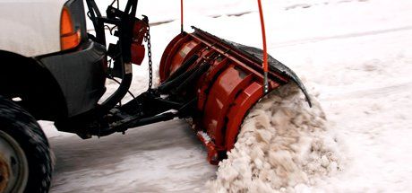 Close up snow plowing