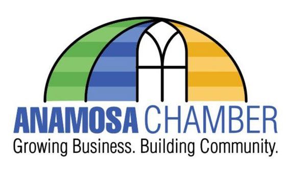 Anamosa Chamber logo with arched bands of green, blue, and gold over a white window. Text: 