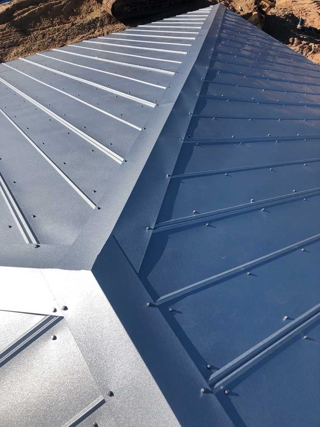 Blue metal roof with visible seams and fasteners.