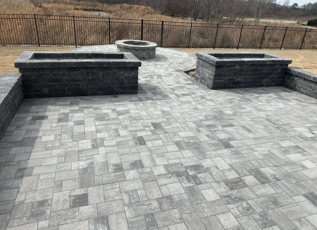 There is a fire pit in the middle of the patio.