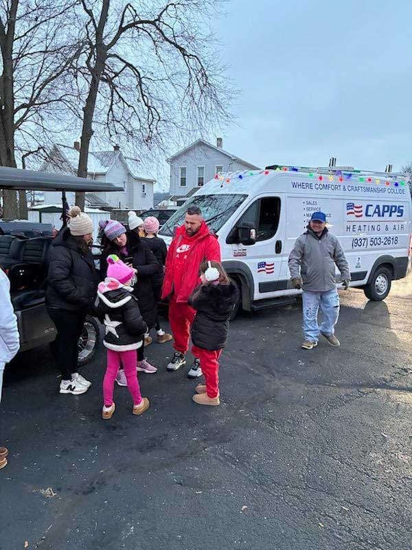People gathered near a white van with 