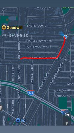 Map view with a red route line from downtown to a point near the right edge, with a blue location pin.