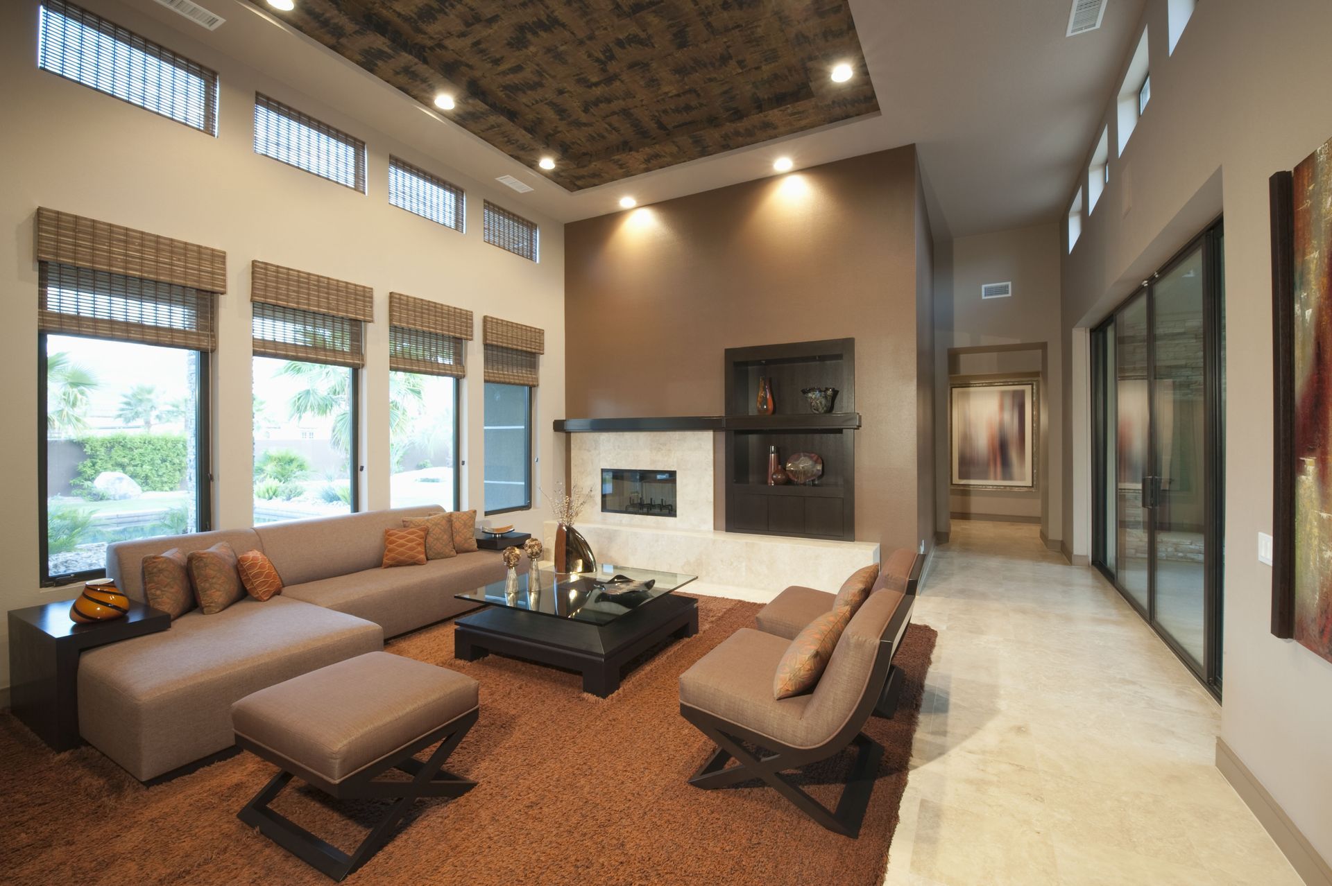 A living room with a couch and chairs and a fireplace