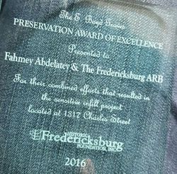 White commemorative text on a dark shirt celebrating the 2016 Preservation Award of Excellence for Fahmey AbdeLatif & The Fredericksburg ARB.
