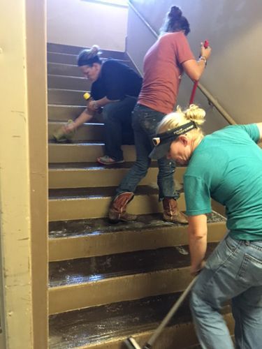 Staff cleanig the stairs