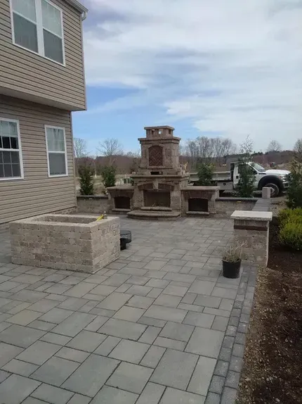 Concrete patio with fireplace