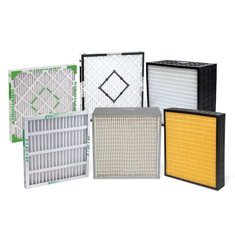 Various air filters of different shapes, sizes, and colors are arranged on a white background.