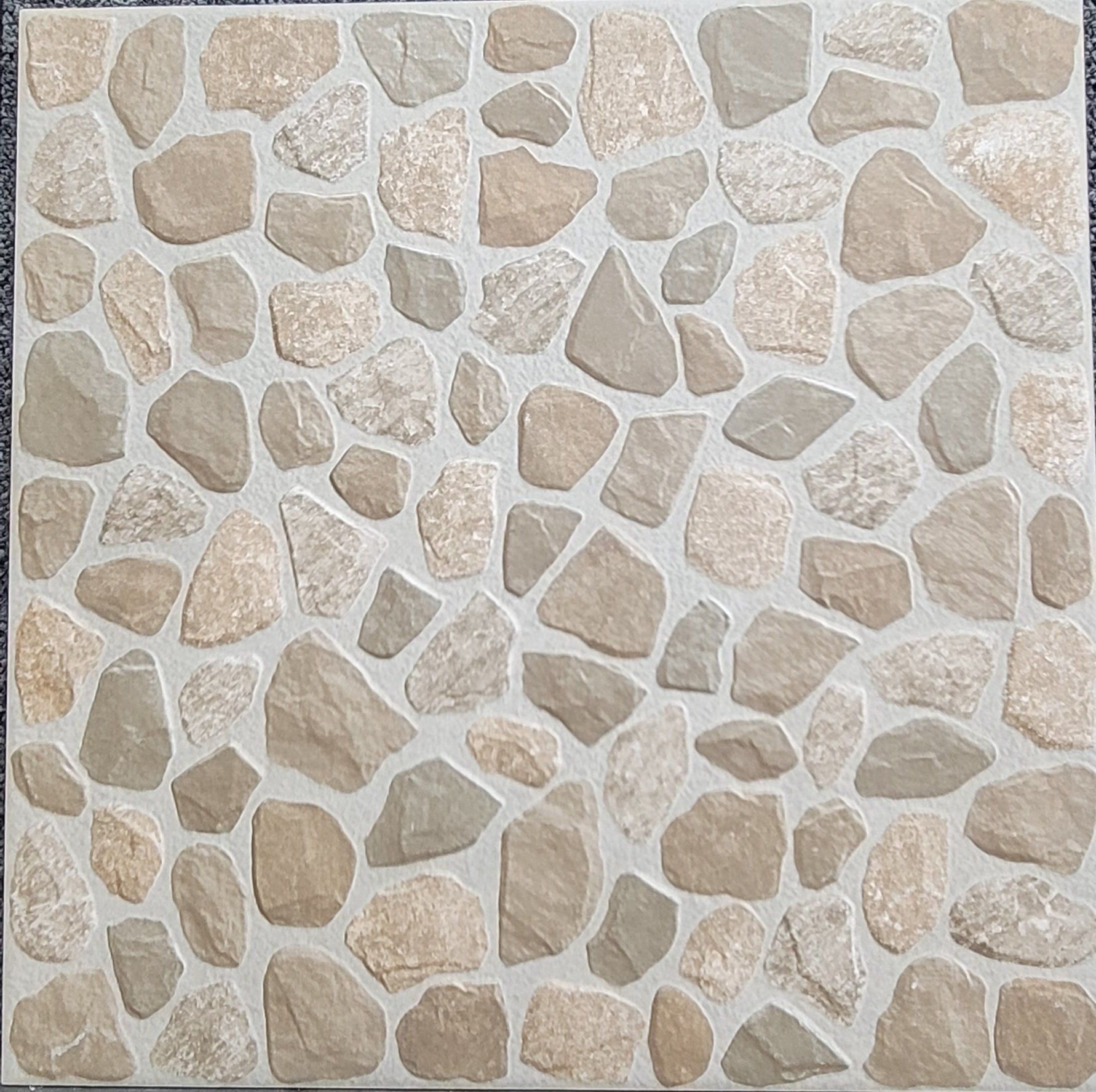 A tile with a pattern of rocks on it