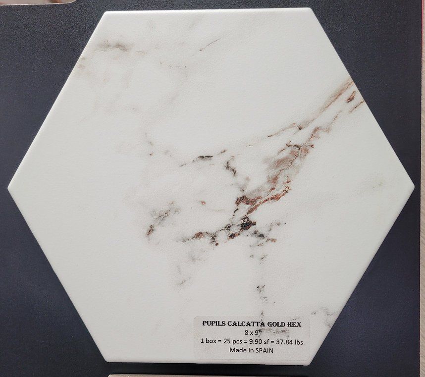 A white hexagonal tile with a brown marble pattern