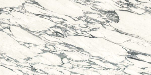 A close up of a white marble counter top with gray veins.