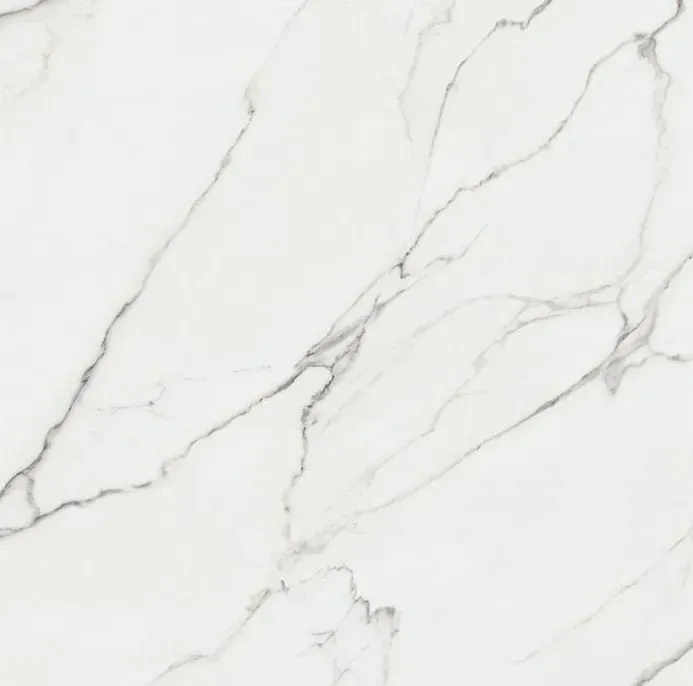 A close up of a white marble tile with black veins.