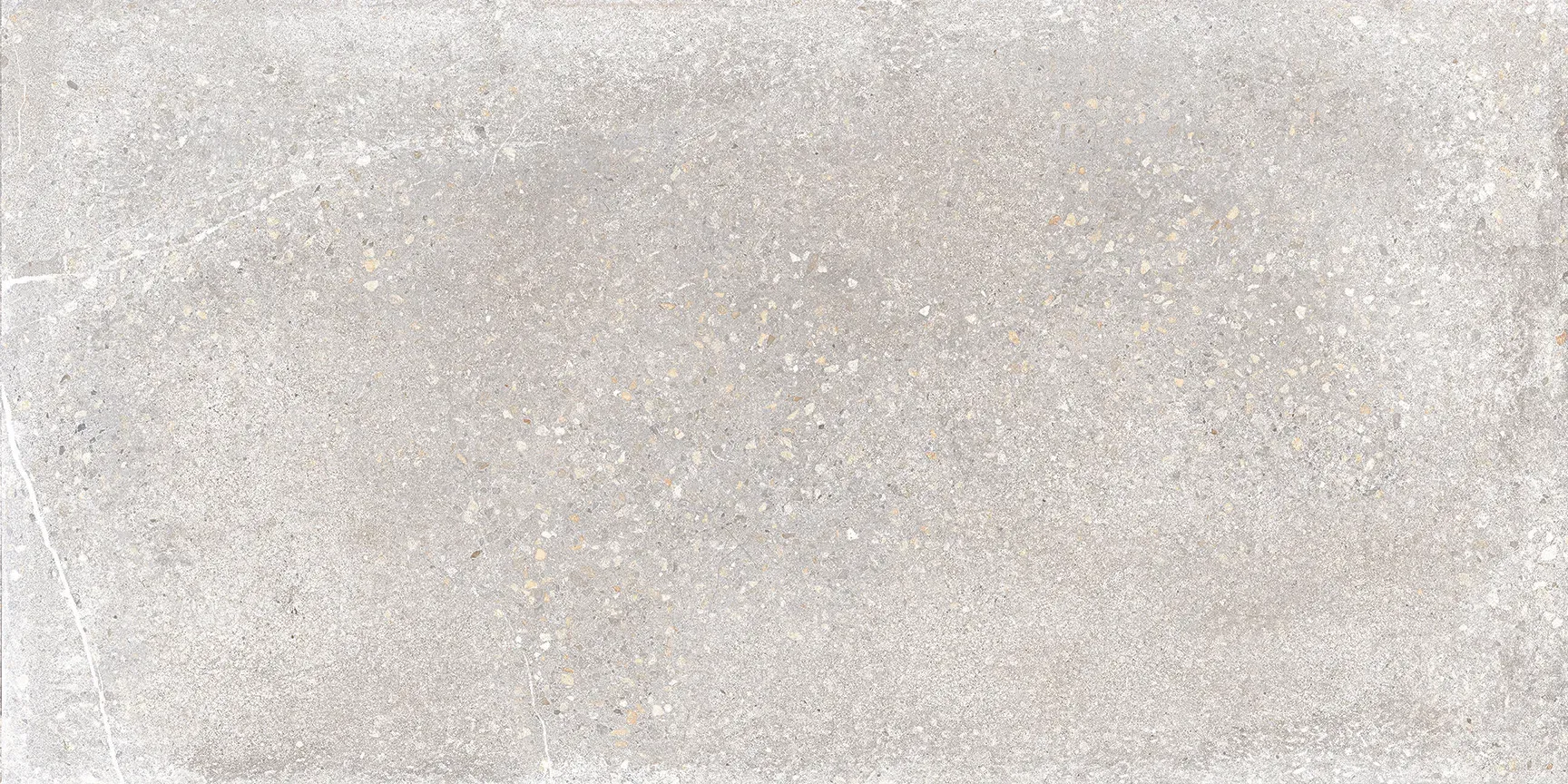 A close up of a white tile with a grainy texture.