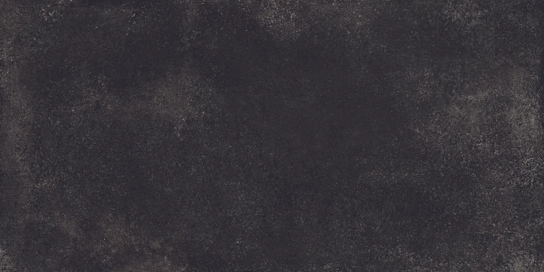 A close up of a black tile with a grunge texture.