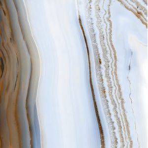 A close up of a piece of wood with a marble texture.