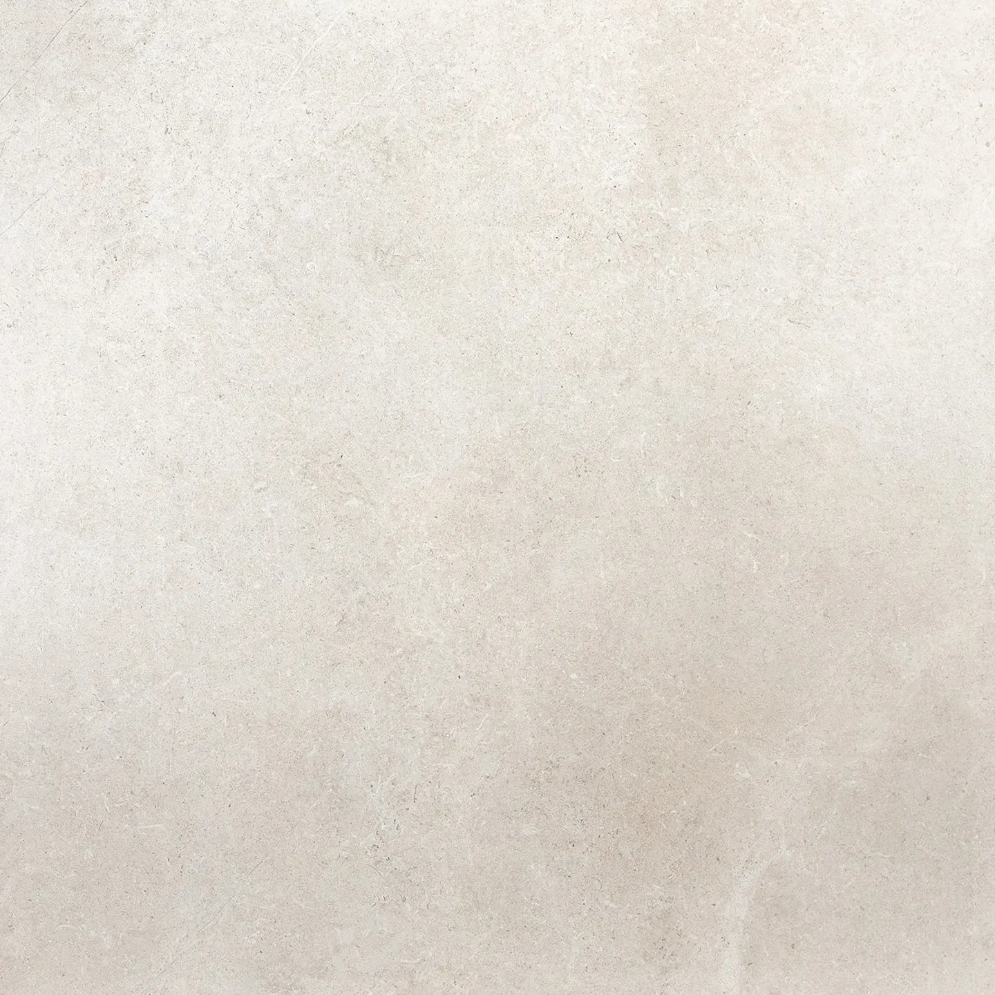 A close up of a white tile with a grainy texture.