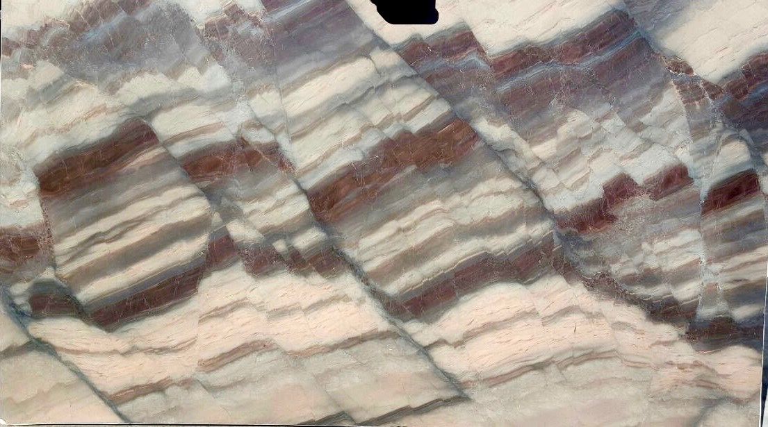 A close up of a piece of marble with a striped pattern.