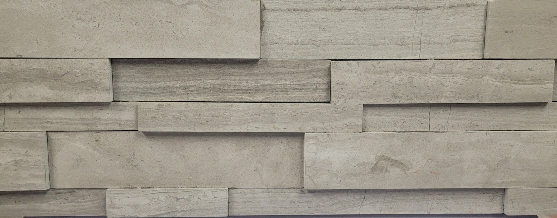 A close up of a stone wall made of bricks.