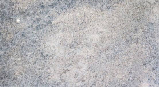 A close up of a gray and white marble texture.