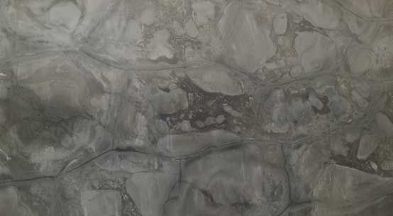 A close up of a gray and white marble texture.
