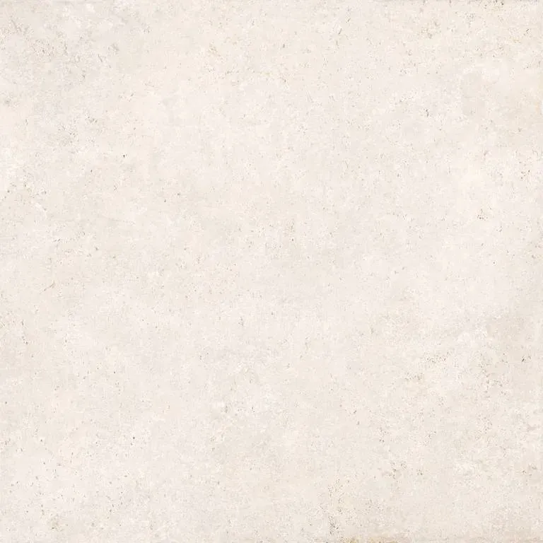 A close up of a white tile with a grainy texture.
