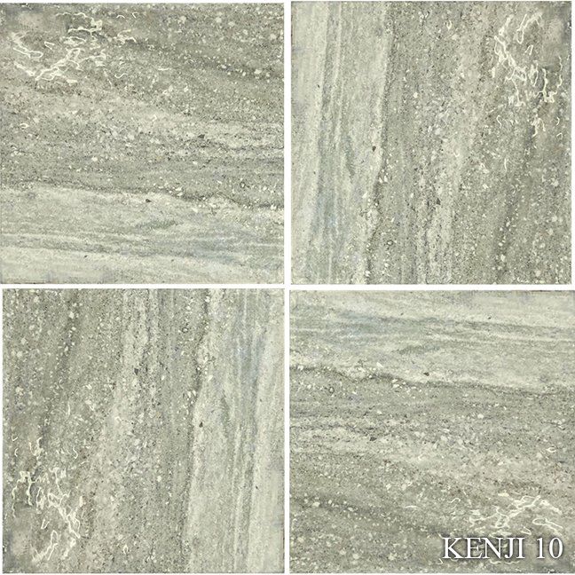 A set of four square tiles with a marble texture