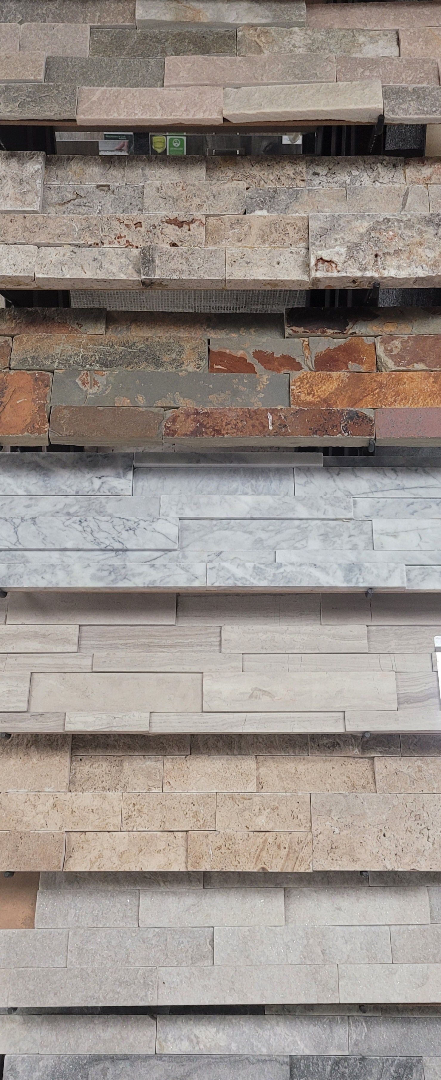 There are many different types of stone stacked on top of each other.