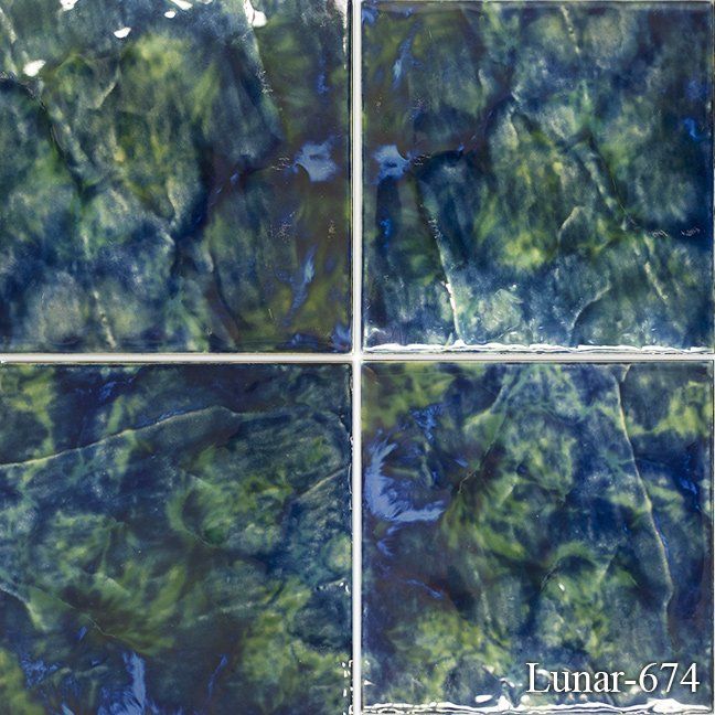 A blue and green tile with the number 674 on it