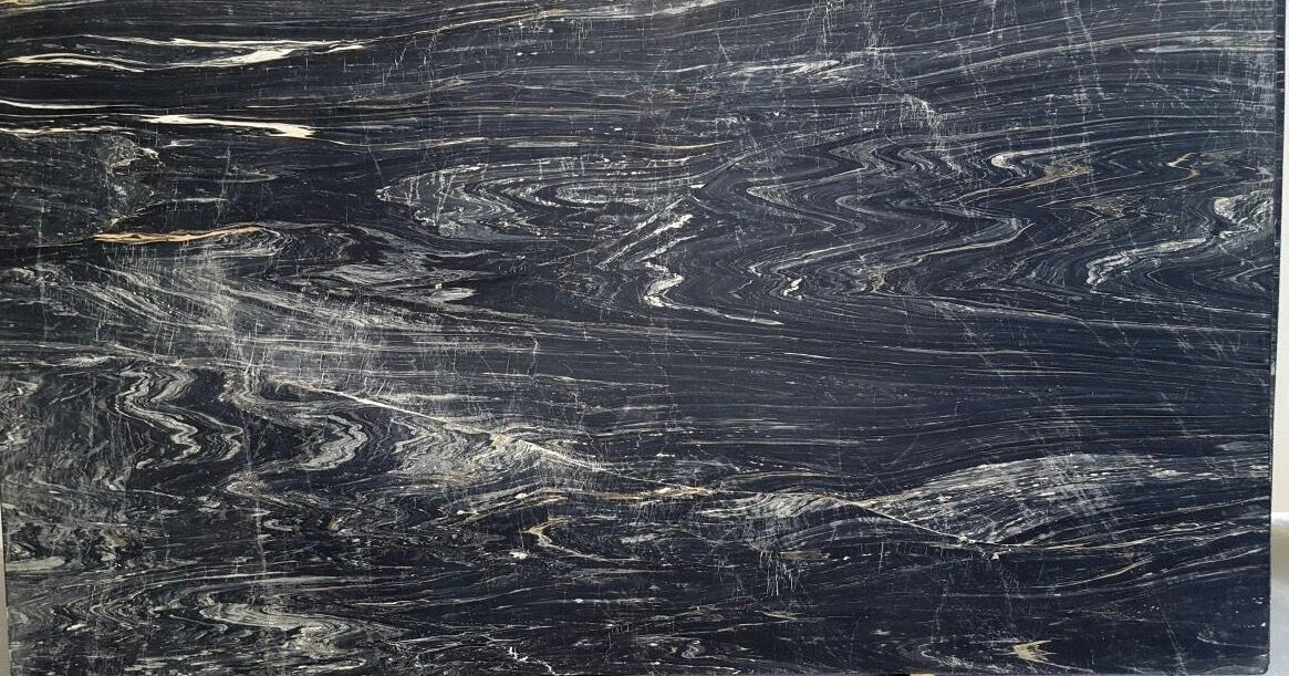 A close up of a black and white marble slab.