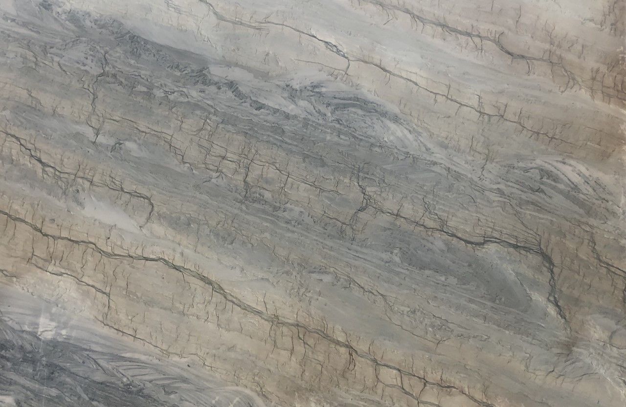 A close up of a marble slab with a gray and white marble texture.