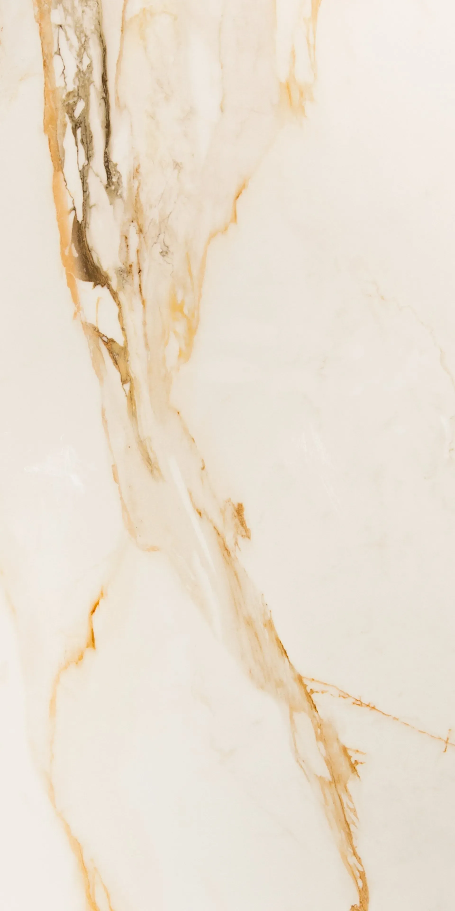 A close up of a white marble tile with a gold marble texture.