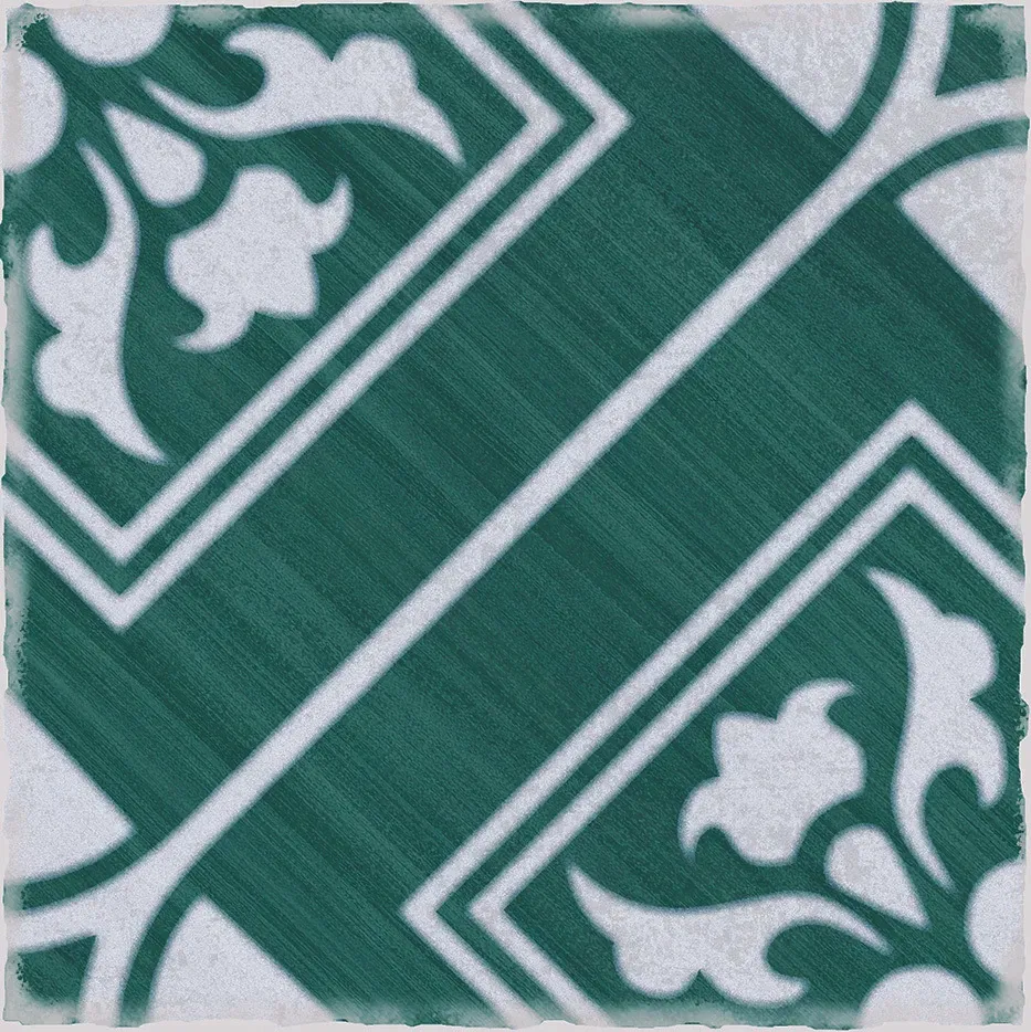 A green and white tile with a floral pattern on it.