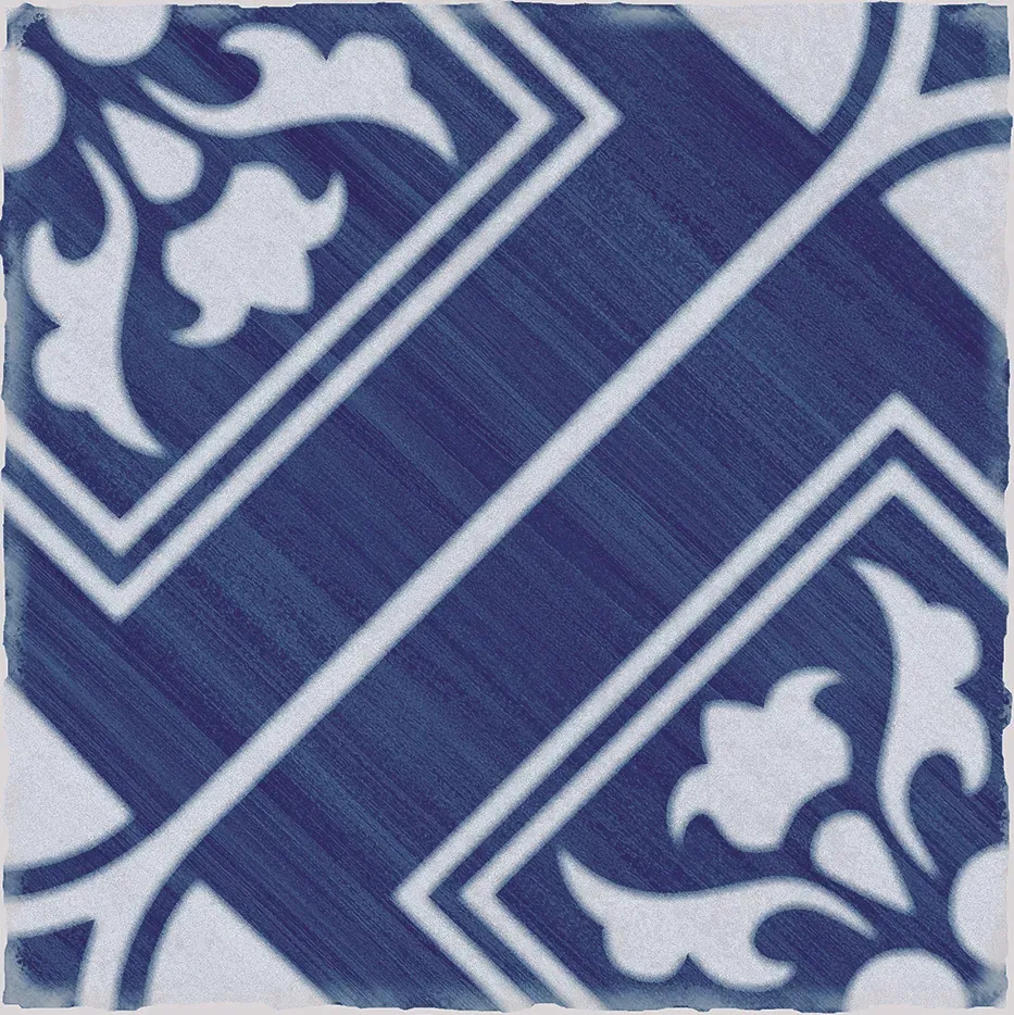 A blue and white tile with a floral pattern on it