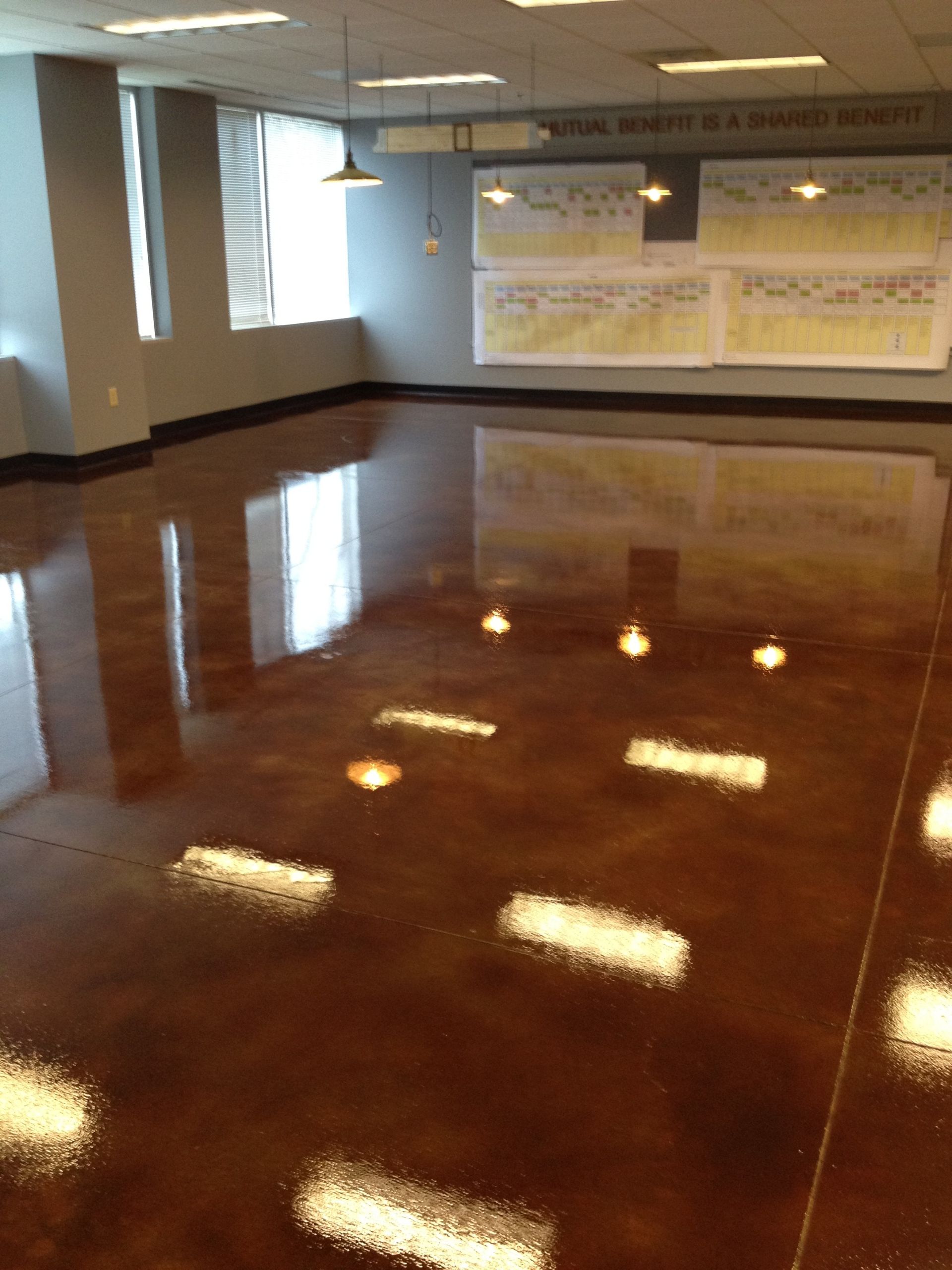 A large room with a shiny concrete floor