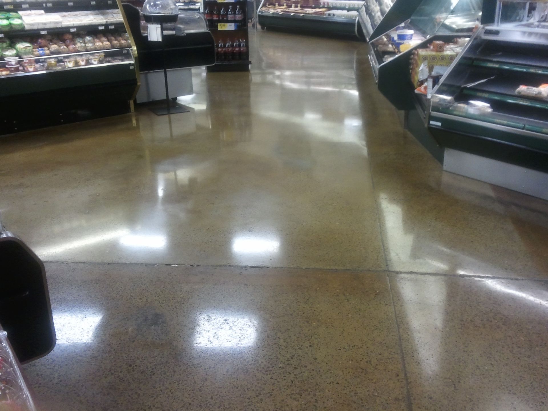 A grocery store with a shiny concrete floor