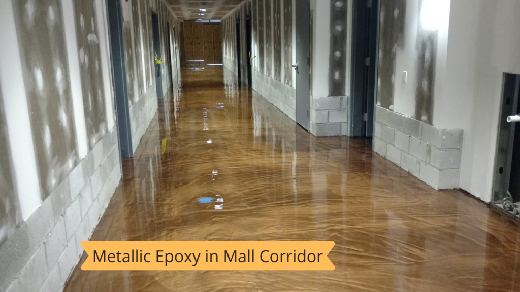 A long hallway with a metallic epoxy floor in a mall.