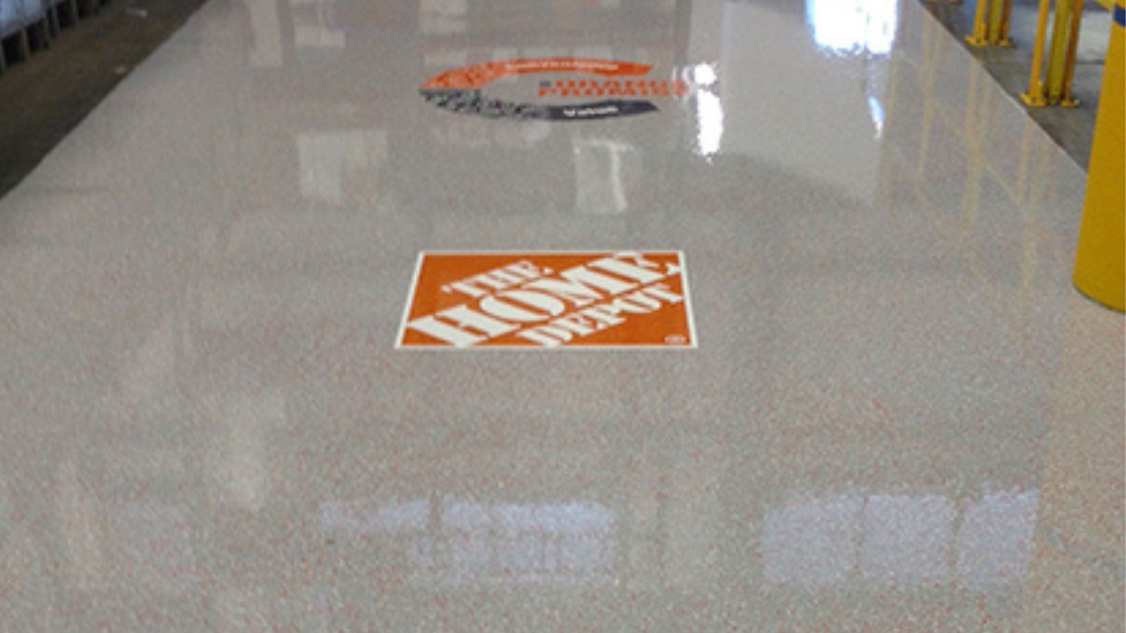 A home depot sign is on the floor of a building